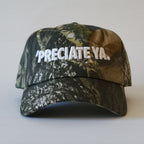 "PRECIATE YA." Snapback Tree Camo/White