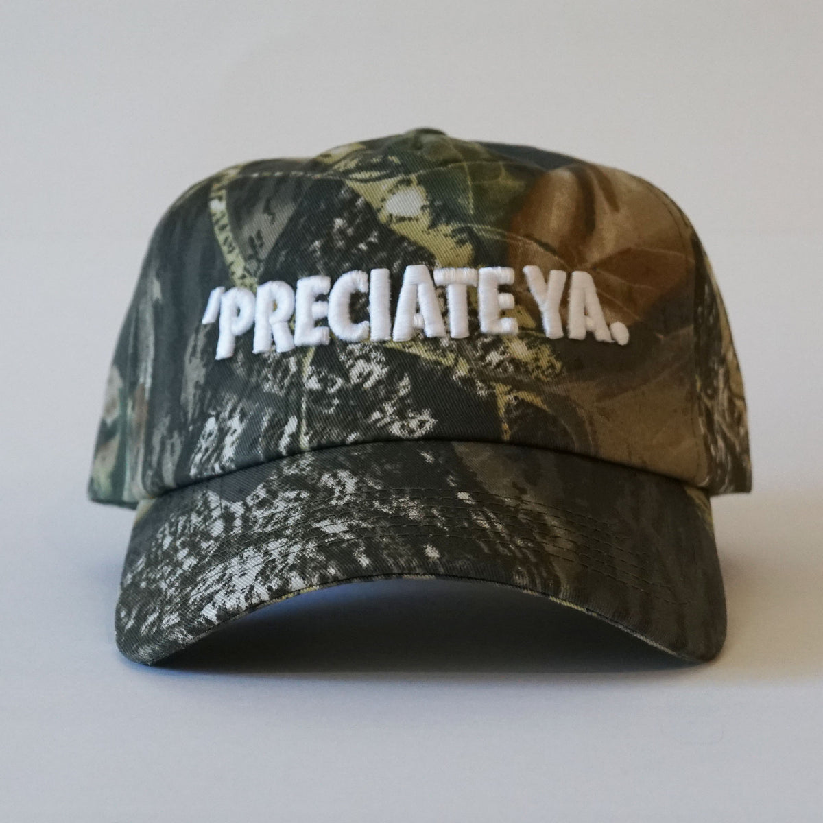"PRECIATE YA." Snapback Tree Camo/White